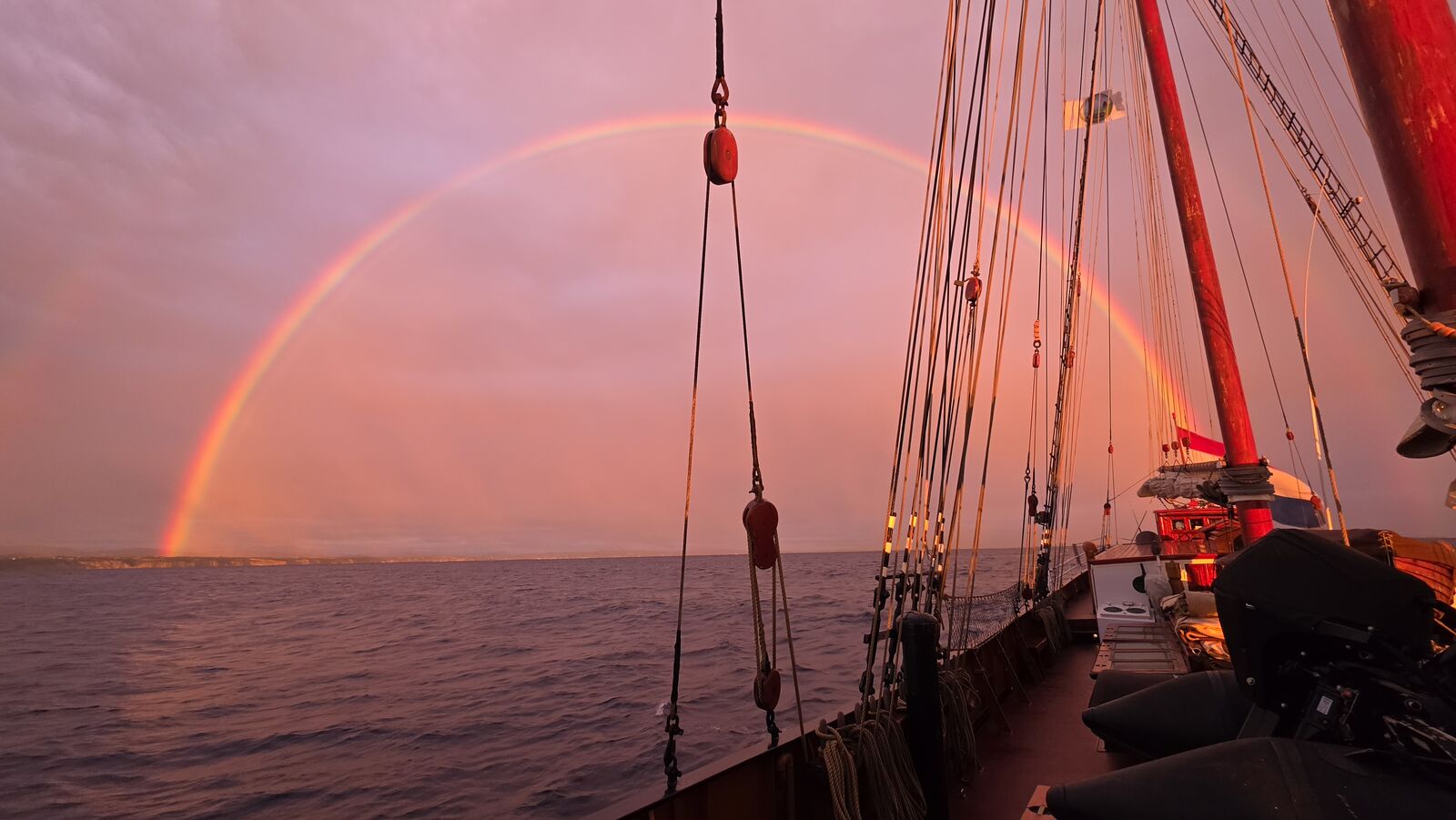 Double rainbow over the deck, coast to port
