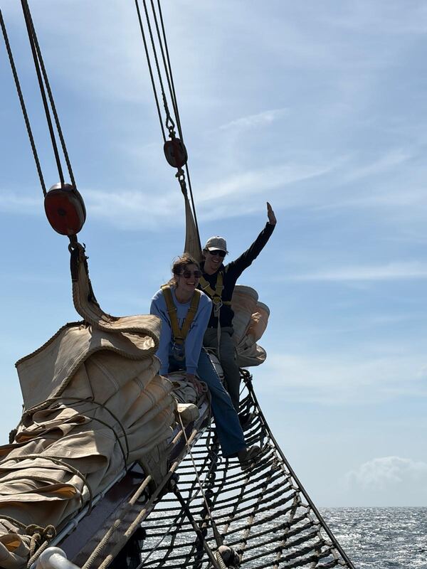 Waving from the bowsprit